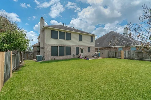 a front view of house with yard and seating area