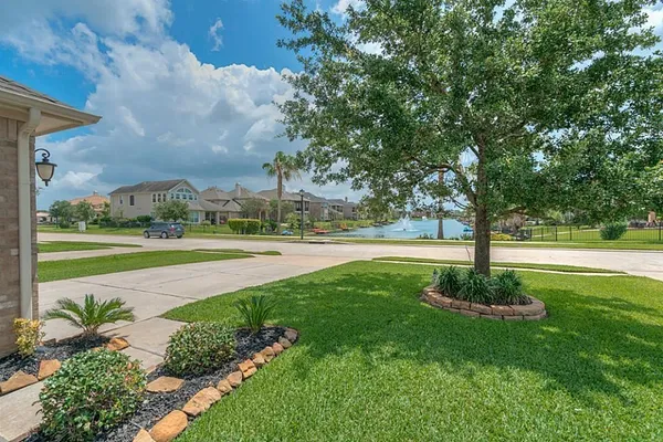 a view of a garden with swimming pool