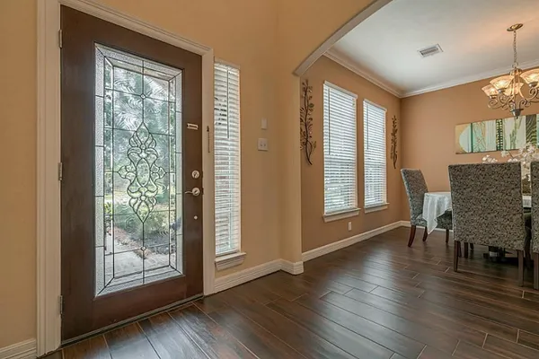 a view of a livingroom with furniture window and wooden floor