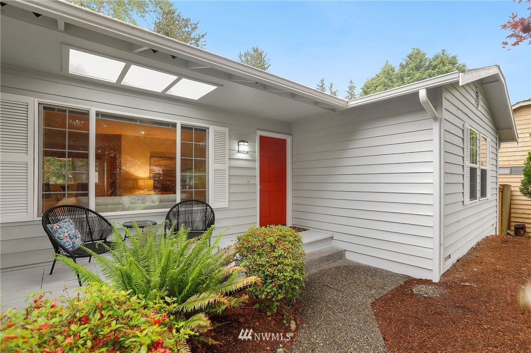 a potted plant sitting in front of a house