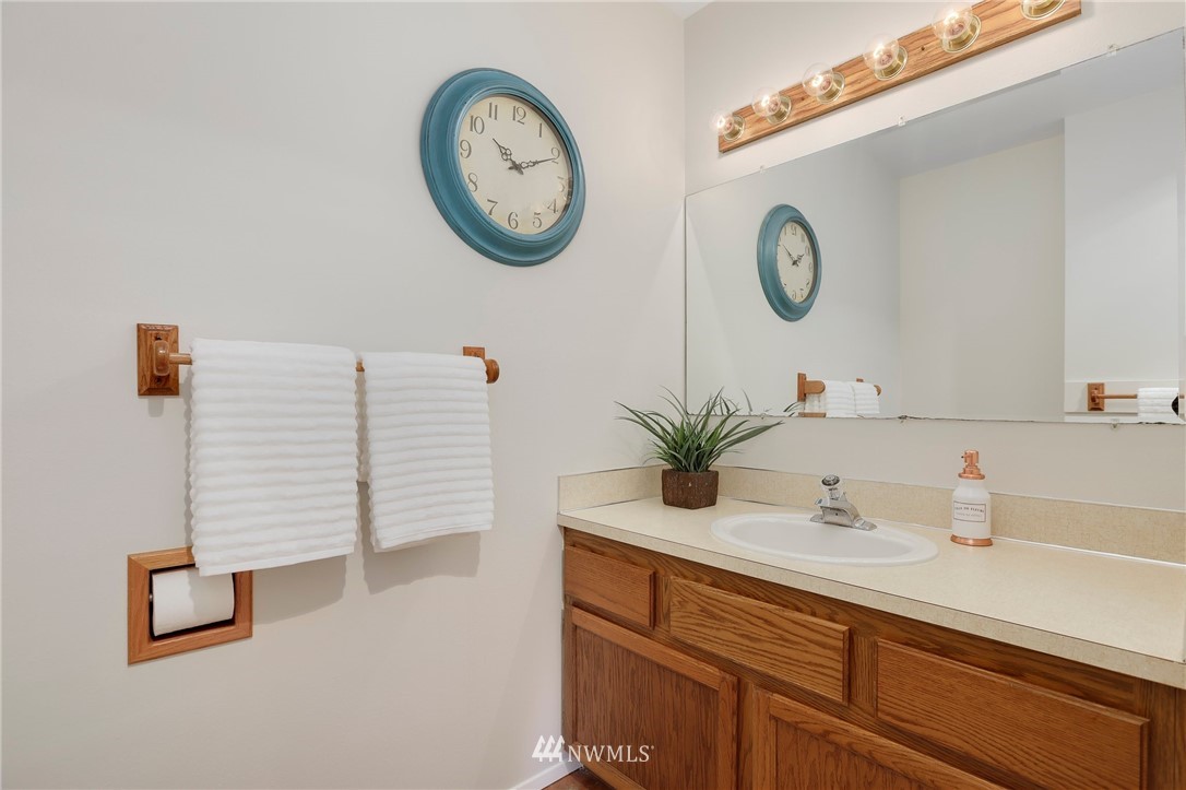 17830 28th Avenue Southeast Bothell, WA 98012 - Photo 13 of 25 a bathroom with a sink and a mirror