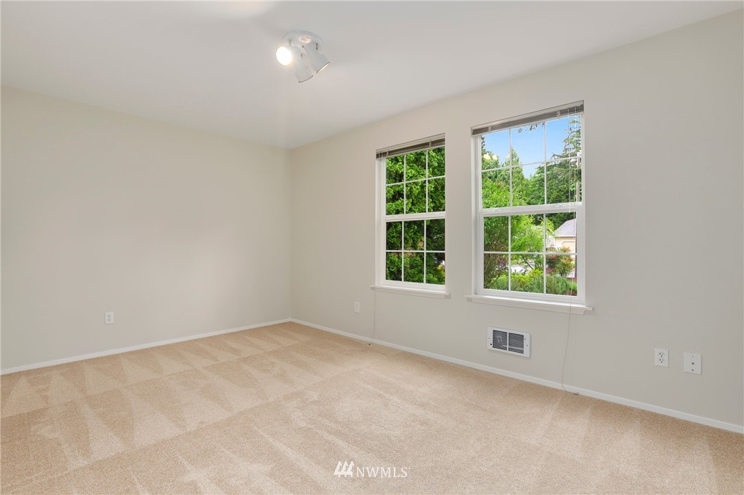 17830 28th Avenue Southeast Bothell, WA 98012 - Photo 15 of 25 an empty room with windows