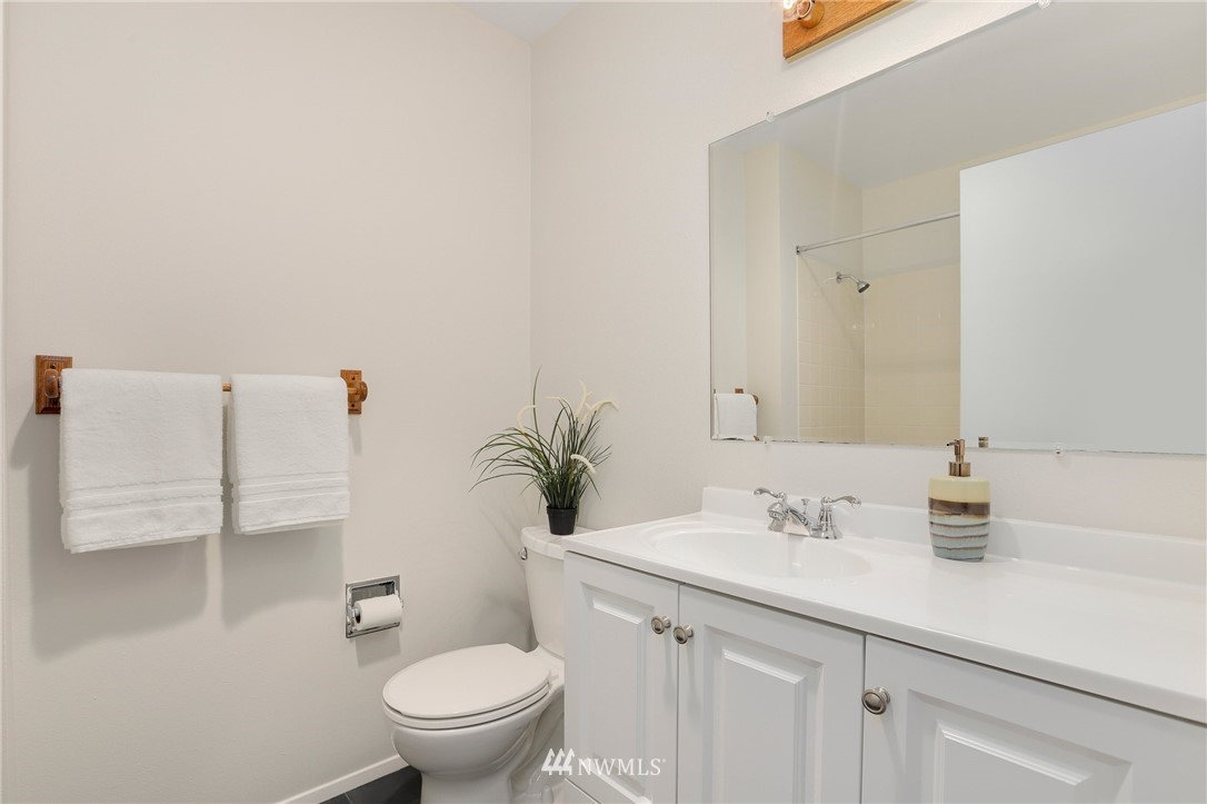 17830 28th Avenue Southeast Bothell, WA 98012 - Photo 16 of 25 a bathroom with a sink a toilet and a mirror