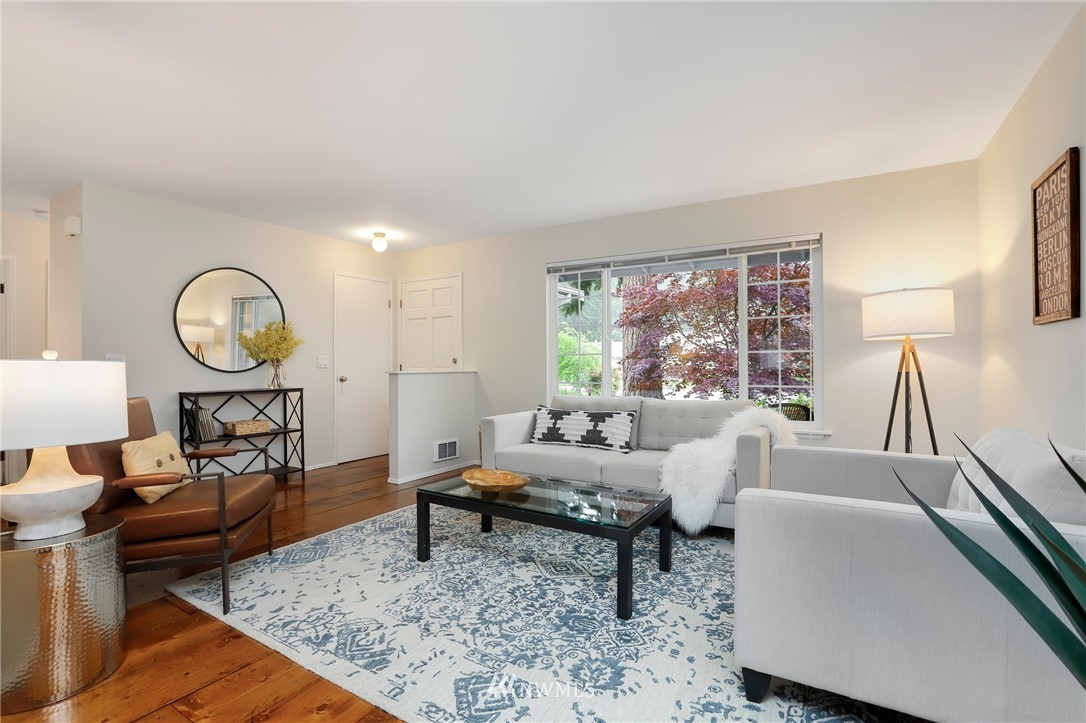 17830 28th Avenue Southeast Bothell, WA 98012 - Photo 4 of 25 a living room with furniture and a large window