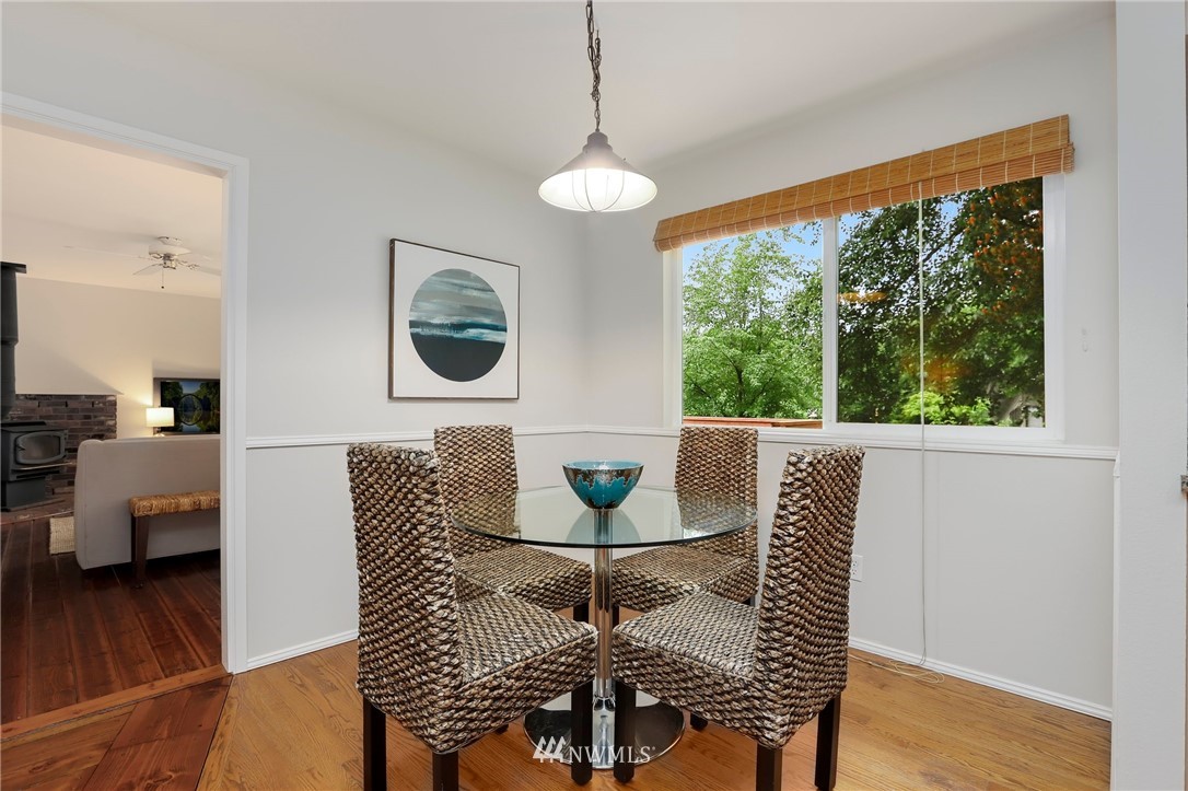 17830 28th Avenue Southeast Bothell, WA 98012 - Photo 9 of 25 a view of a dining room with furniture wooden floor and a chandelier