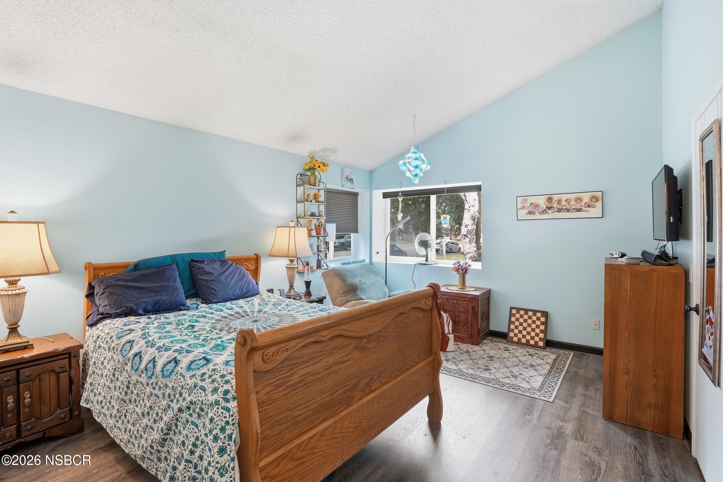 218 North R Street Lompoc, CA 93436 - Photo 18 of 24 a bed room with two bed and a couch