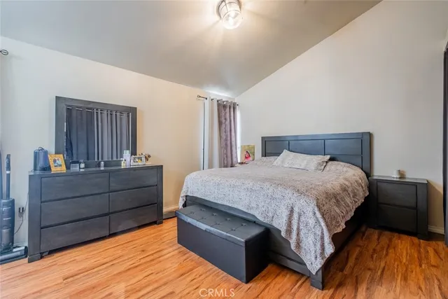 a bed room with a bed and a dresser