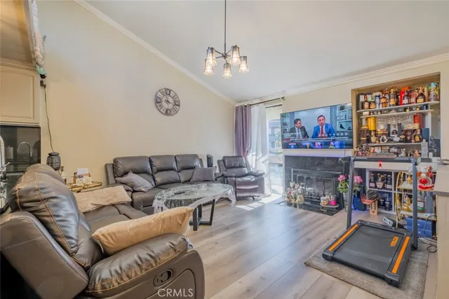 a living room with furniture a couch and a bookshelf