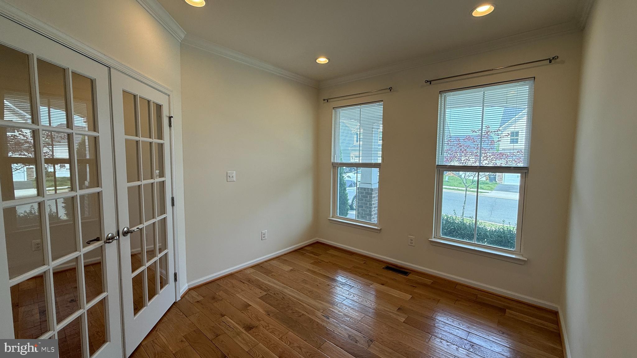 12421 Mays Quarter Road Woodbridge, VA 22192 - Photo 12 of 30 a view of an empty room with wooden floor and a window