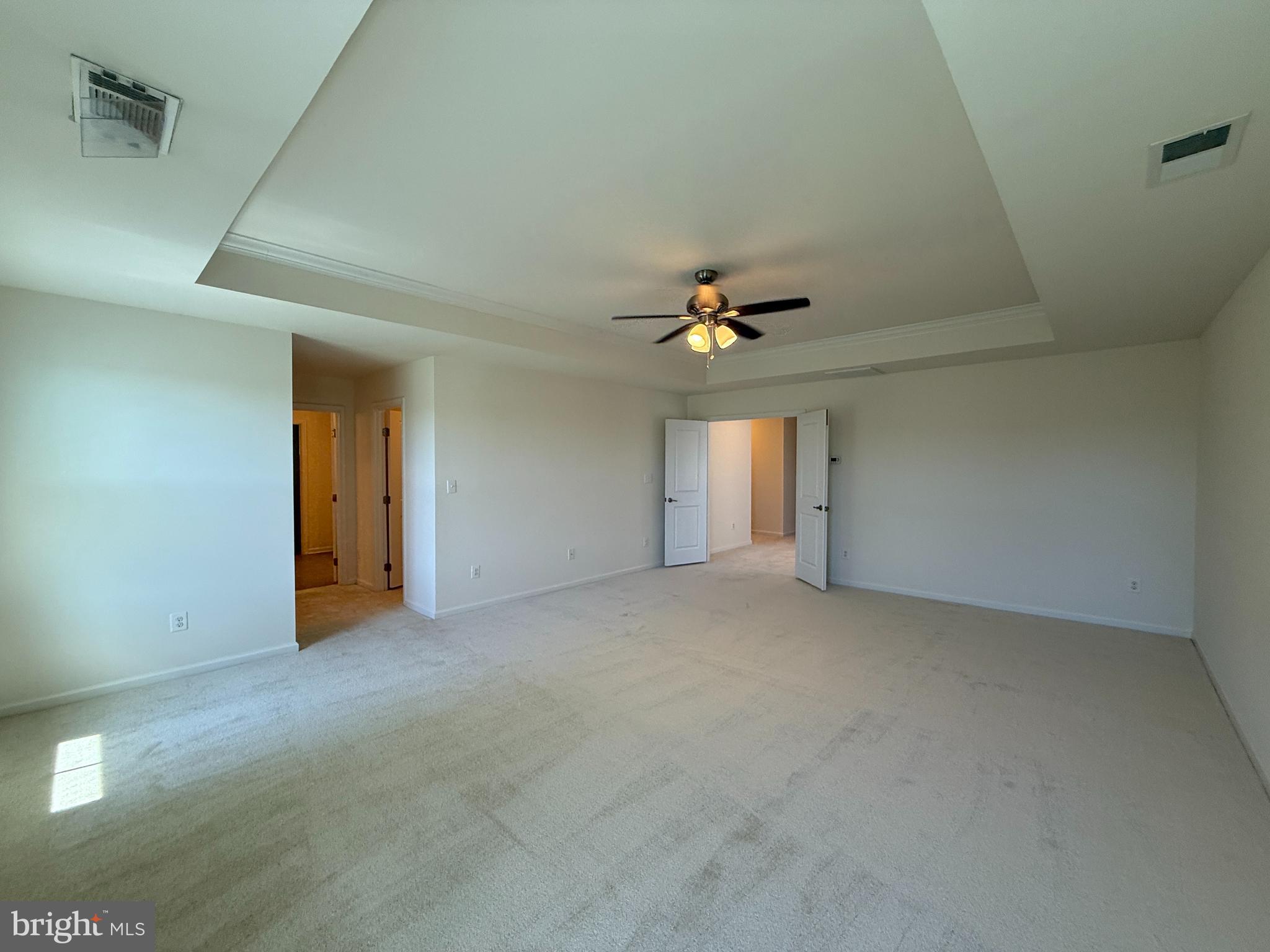 12421 Mays Quarter Road Woodbridge, VA 22192 - Photo 14 of 30 a view of an empty room with a chandelier fan