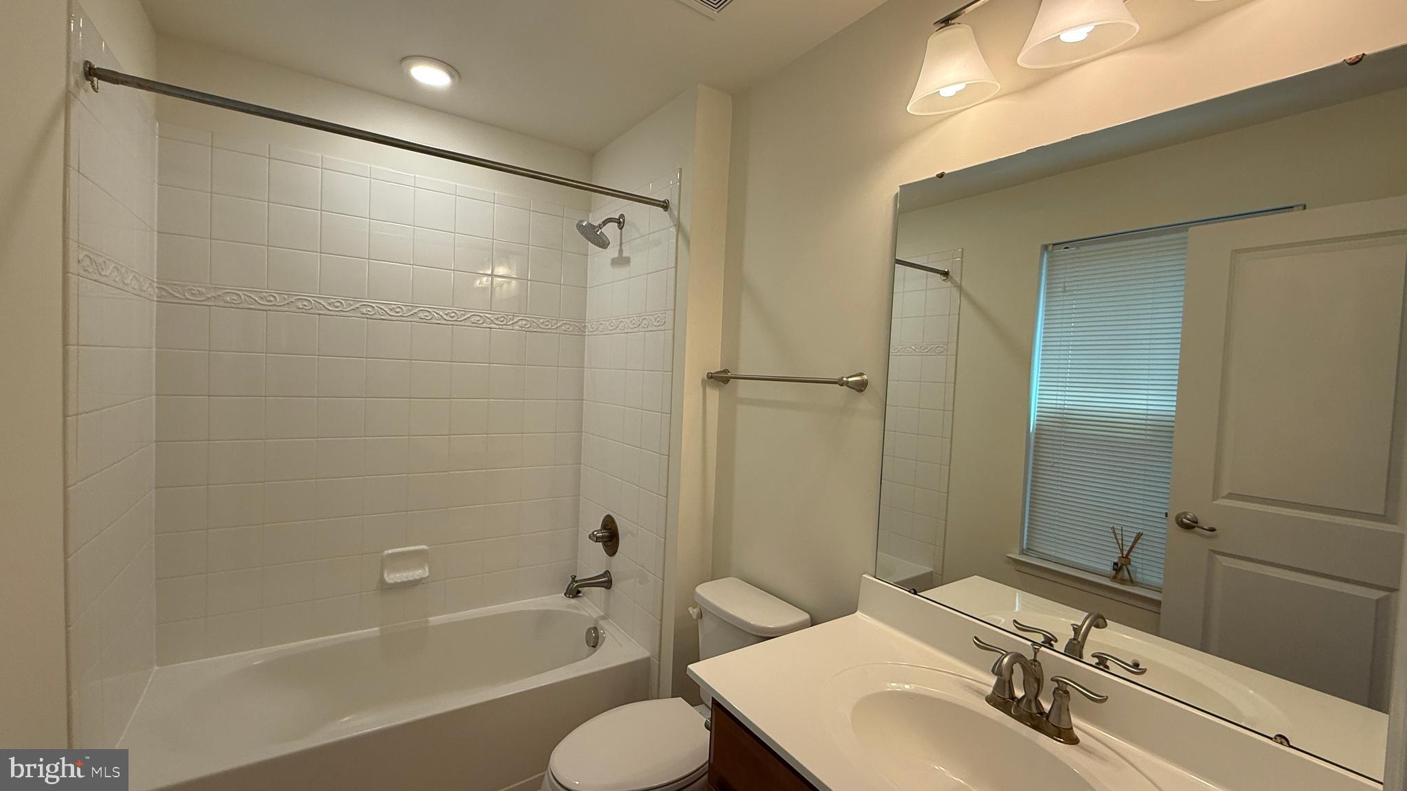 12421 Mays Quarter Road Woodbridge, VA 22192 - Photo 23 of 30 a bathroom with a sink toilet and shower