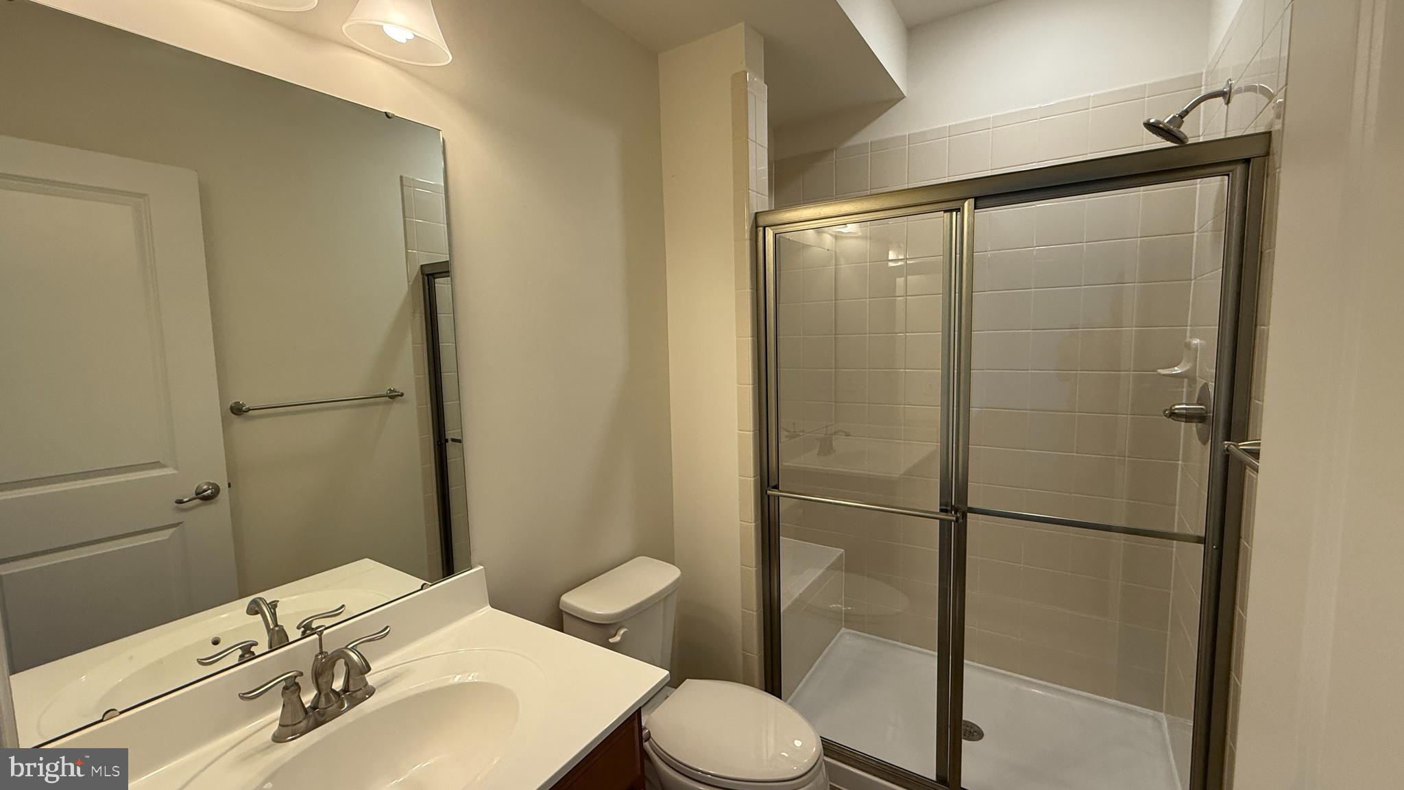 12421 Mays Quarter Road Woodbridge, VA 22192 - Photo 27 of 30 a bathroom with a sink toilet and shower