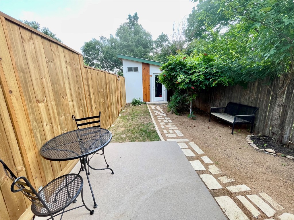 1023 Nile Street, Unit B Austin, TX 78702 - Photo 12 of 14 Back yard with laundry room.