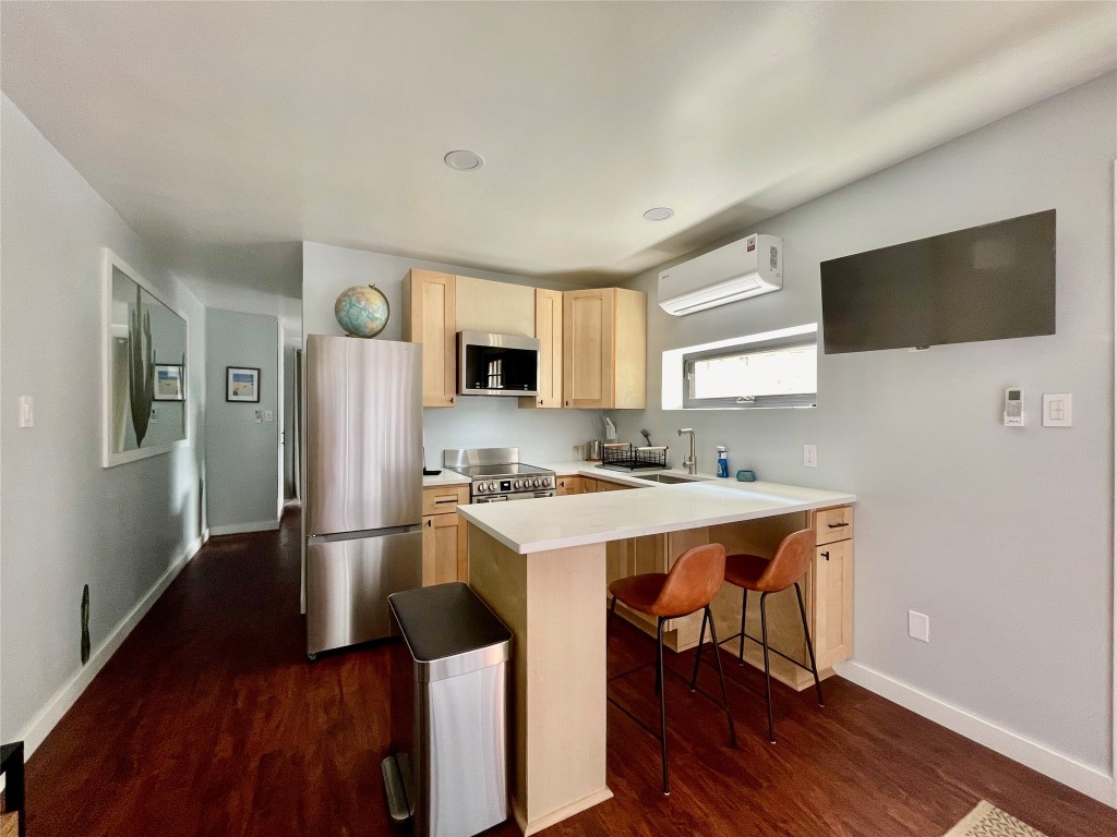 1023 Nile Street, Unit B Austin, TX 78702 - Photo 3 of 14 View of kitchen towards bed area.