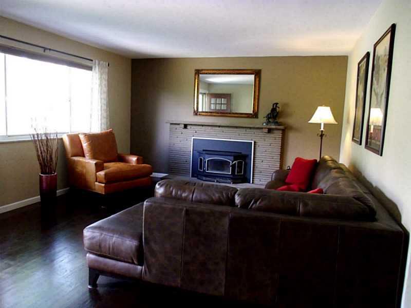923 Girard Road Whitehall, PA 15227 - Photo 3 of 25 Living Room. Spacious & Bright w/ Log Burning Fireplace & Stove