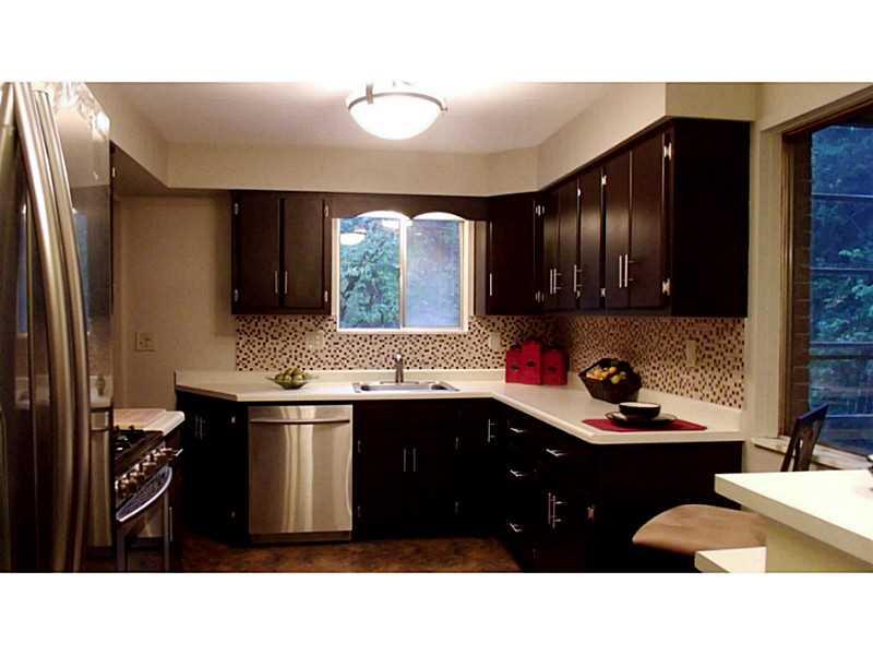 923 Girard Road Whitehall, PA 15227 - Photo 5 of 25 Kitchen. Updated Kitchen w/ Expresso Cabinets & Almond Countertop