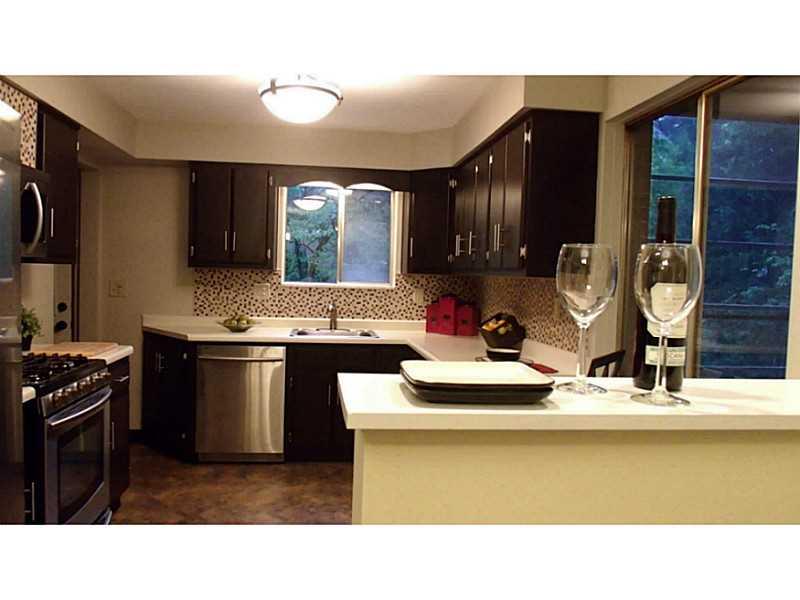 923 Girard Road Whitehall, PA 15227 - Photo 6 of 25 Kitchen. Open Concept Kitchen w/ Serving Bar to Dining Room