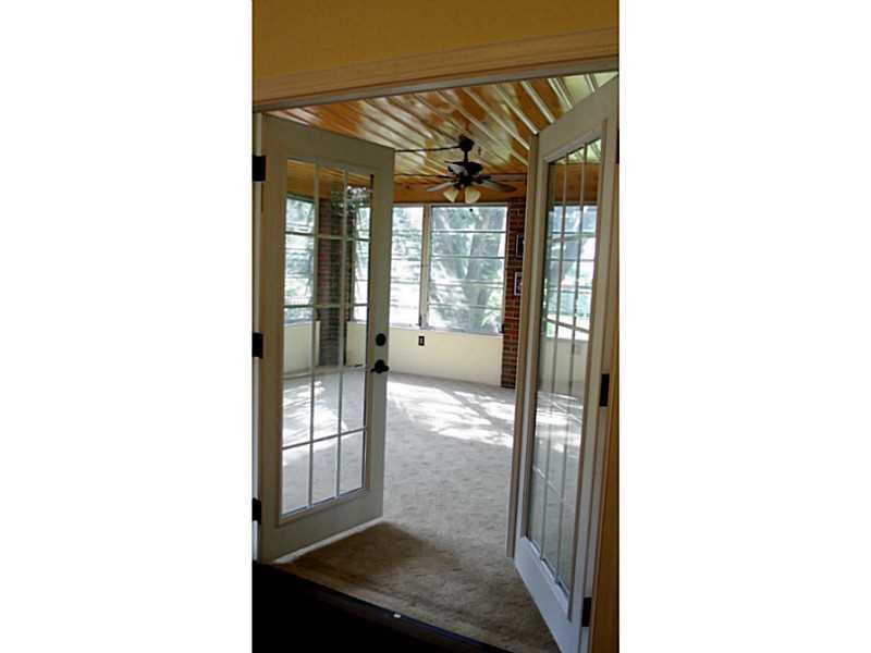 923 Girard Road Whitehall, PA 15227 - Photo 10 of 25 Sunroom. French Doors in DR Open to 3 Season Room