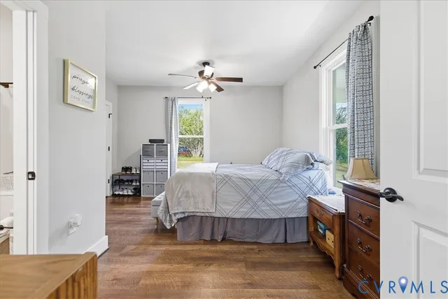 a spacious bedroom with a bed and a window