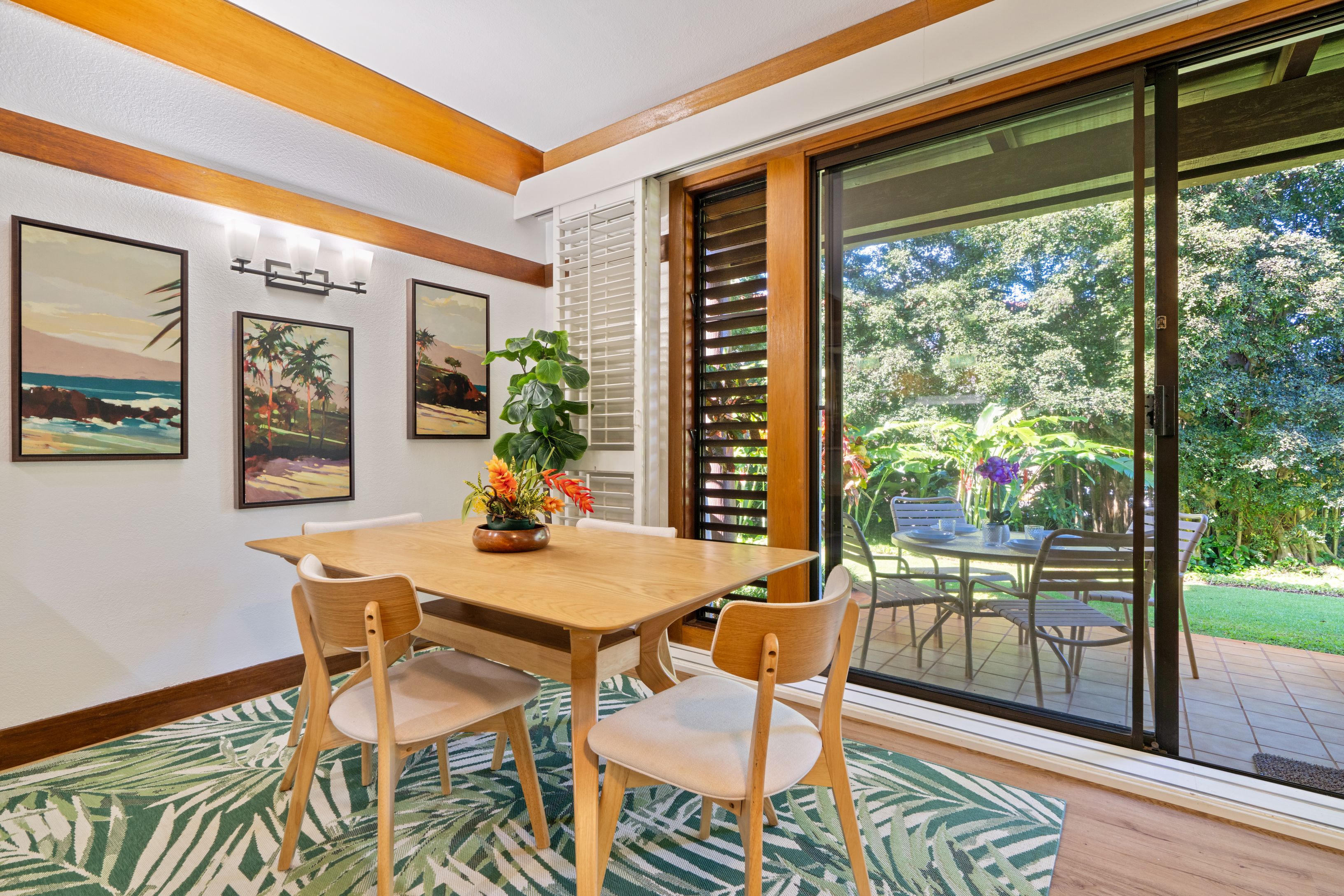 2253 Poipu Road, Unit 419 Koloa, HI 96756 - Photo 14 of 30 a dining room with furniture wooden floor and a rug