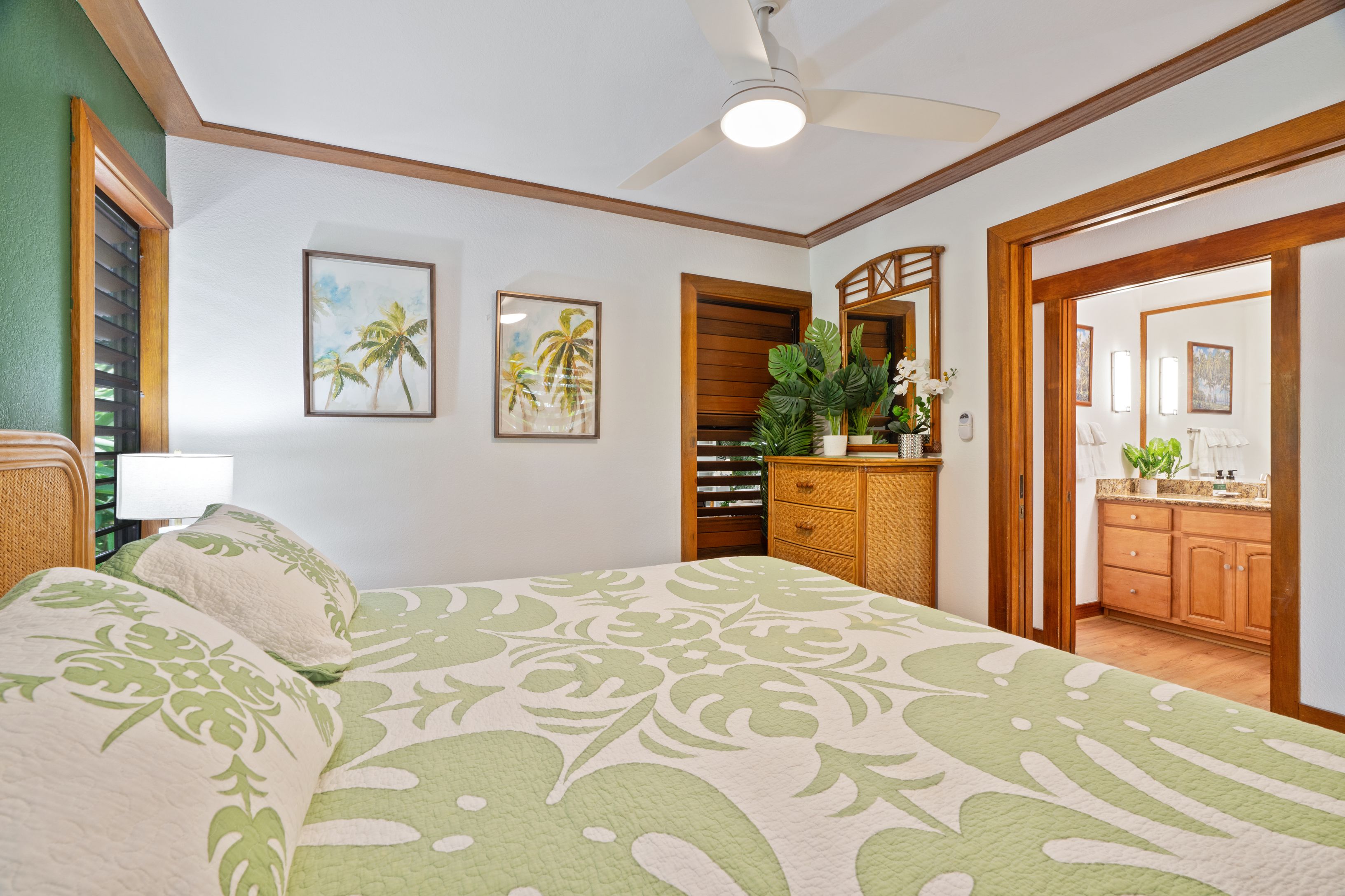 2253 Poipu Road, Unit 419 Koloa, HI 96756 - Photo 21 of 30 a bedroom with a large bed and a chandelier