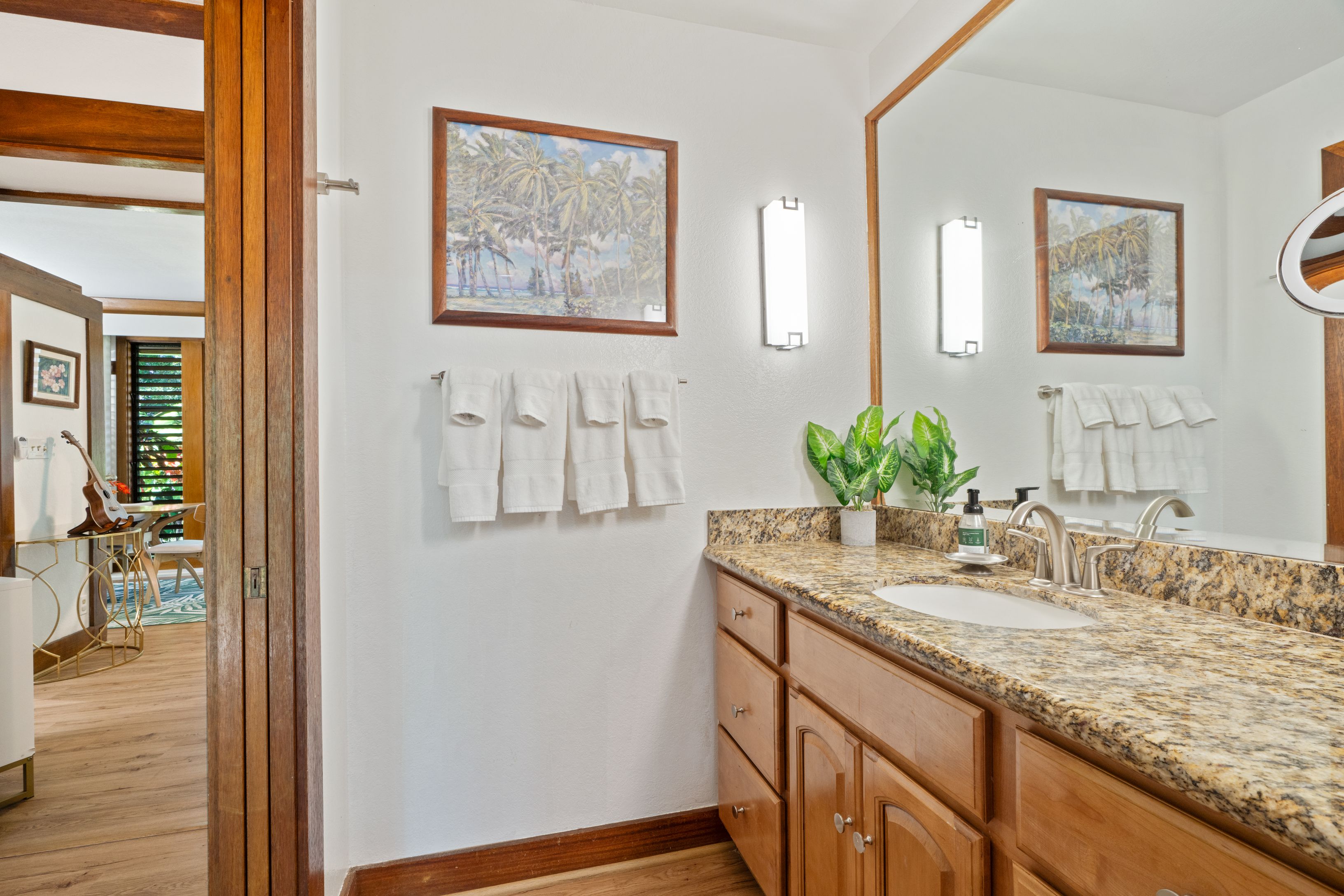 2253 Poipu Road, Unit 419 Koloa, HI 96756 - Photo 24 of 30 a bathroom with a granite countertop sink a mirror and a shower