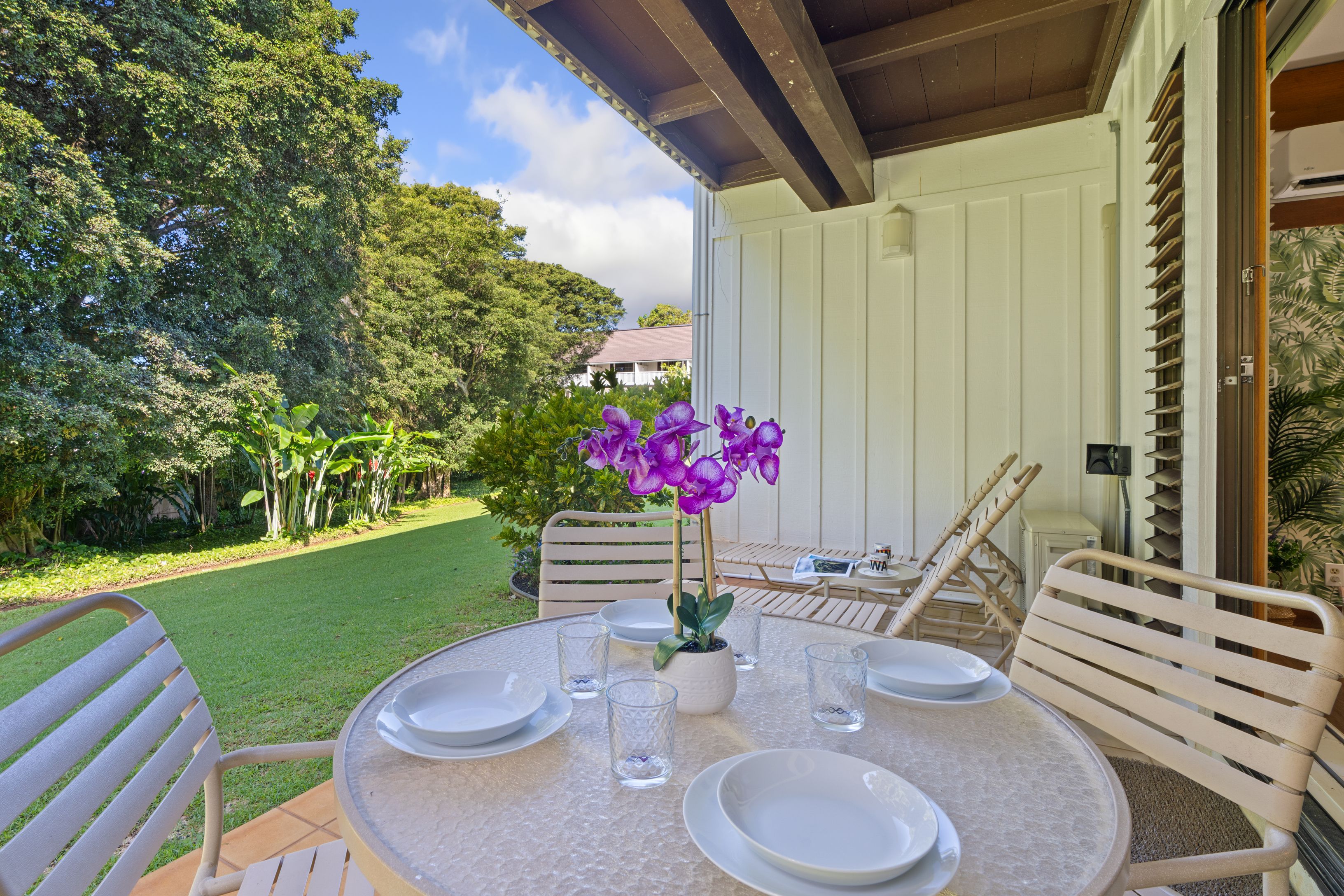 2253 Poipu Road, Unit 419 Koloa, HI 96756 - Photo 25 of 30 a view of a dining room with furniture and wooden floor
