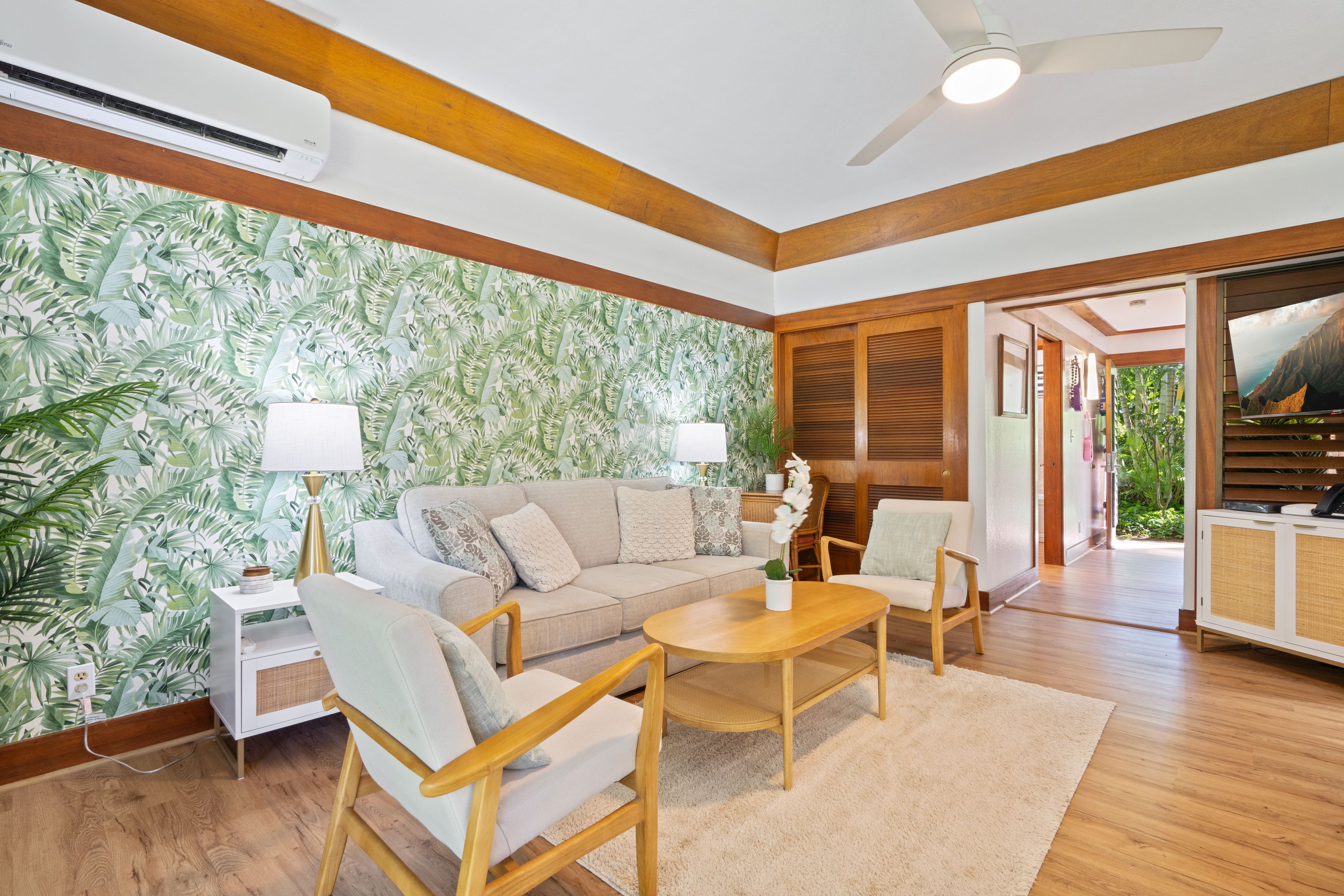 2253 Poipu Road, Unit 419 Koloa, HI 96756 - Photo 6 of 30 a living room with fireplace furniture and a large window