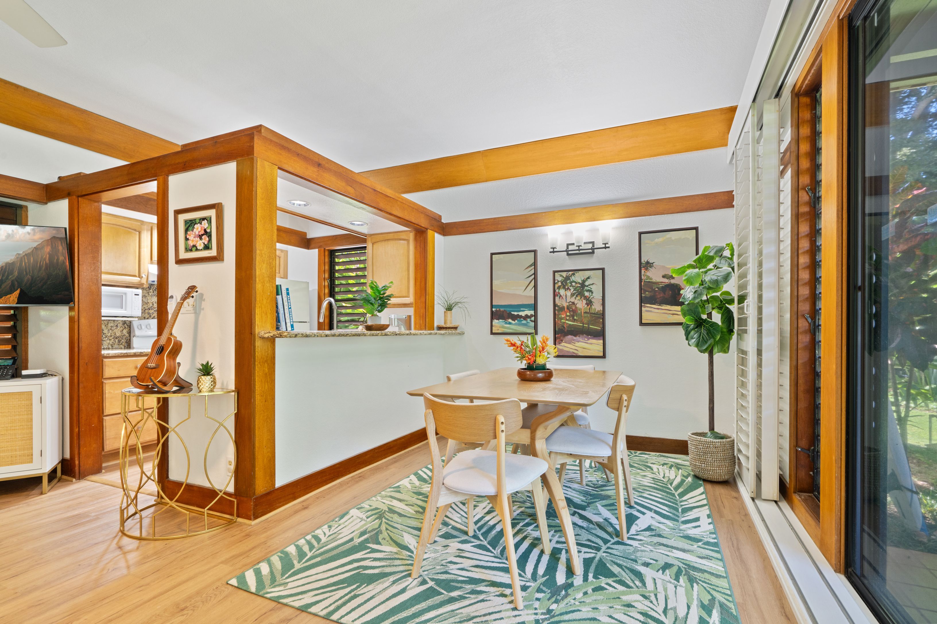 2253 Poipu Road, Unit 419 Koloa, HI 96756 - Photo 7 of 30 a view of a dining room with furniture window and wooden floor