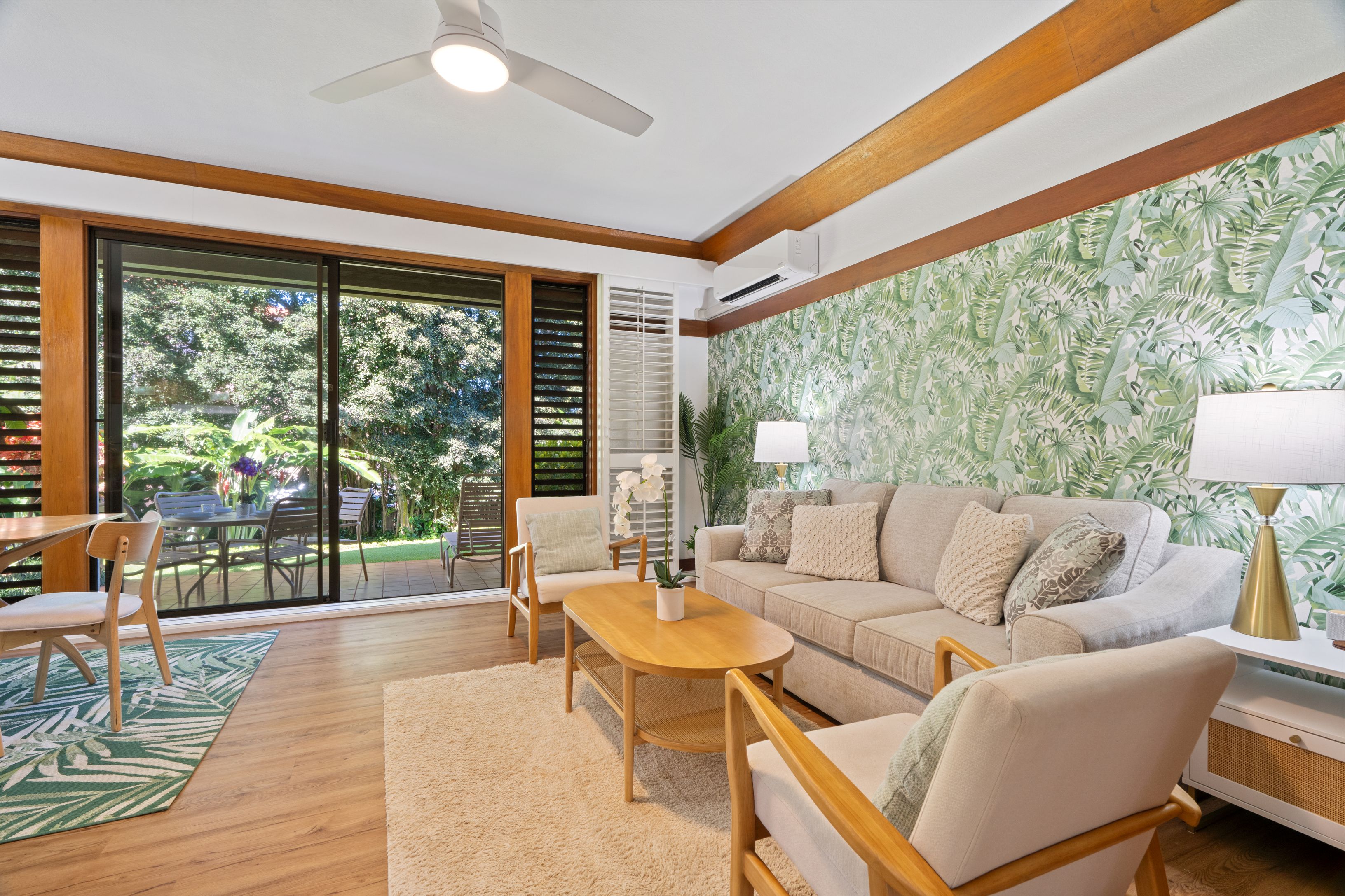 2253 Poipu Road, Unit 419 Koloa, HI 96756 - Photo 8 of 30 a living room with furniture and a large window