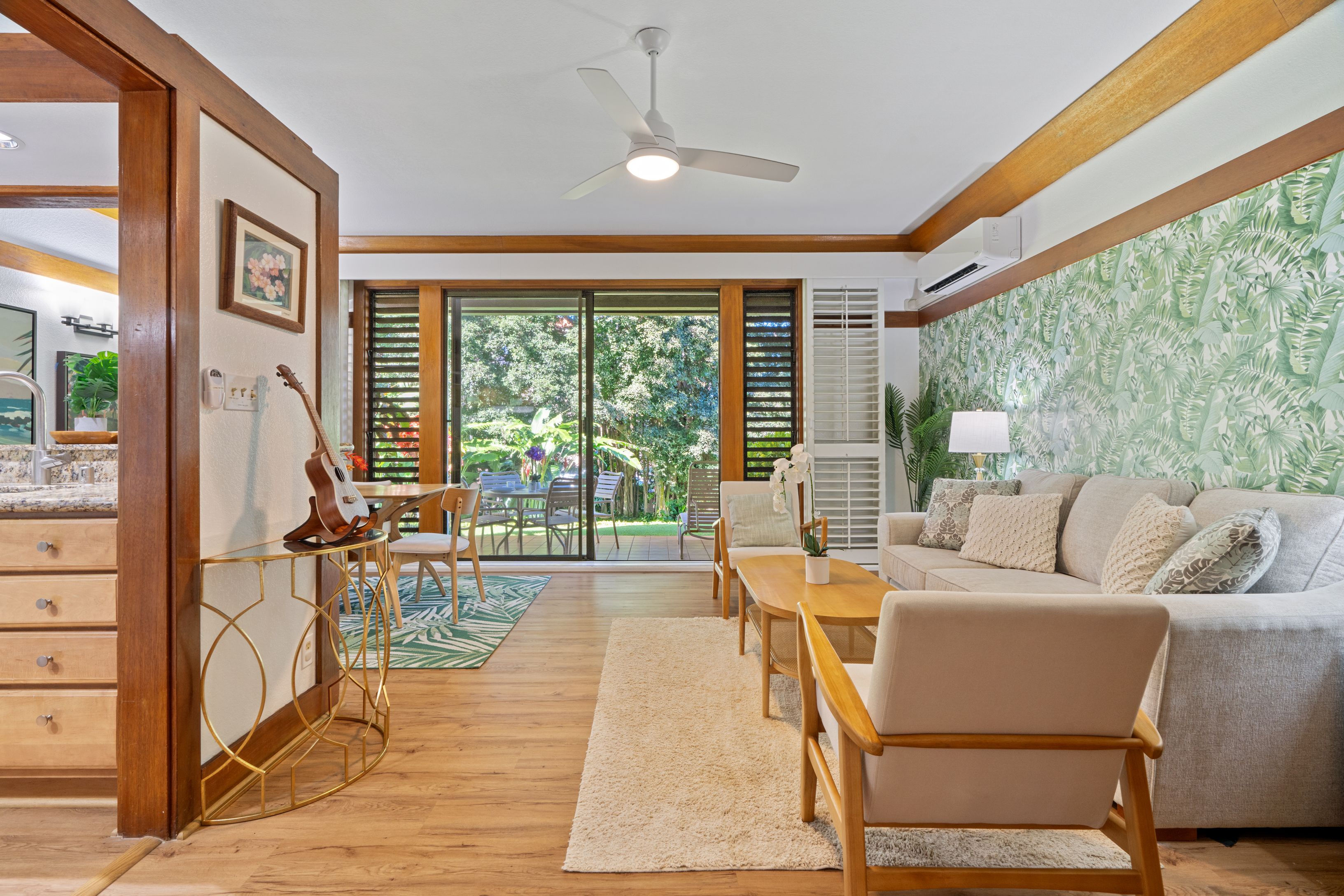 2253 Poipu Road, Unit 419 Koloa, HI 96756 - Photo 10 of 30 a living room with furniture and a floor to ceiling window