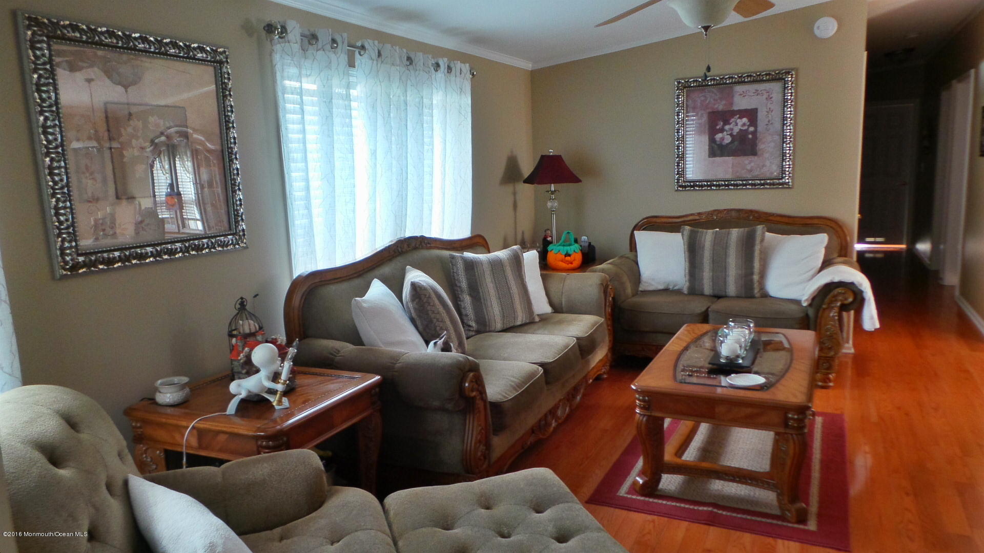 86 Village Road, Unit 86 Morganville, NJ 07751 - Photo 7 of 22 a living room with furniture and a window