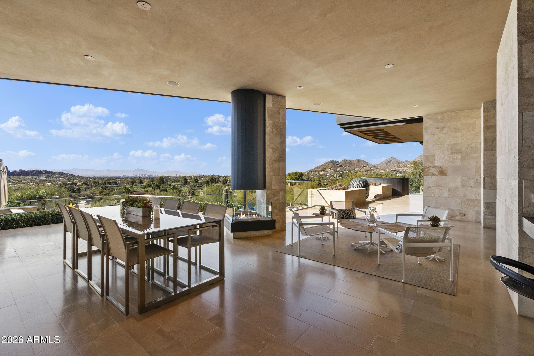 5248 East Arroyo Road Paradise Valley, AZ 85253 - Photo 23 of 31 a view of a terrace with furniture and a floor to ceiling window