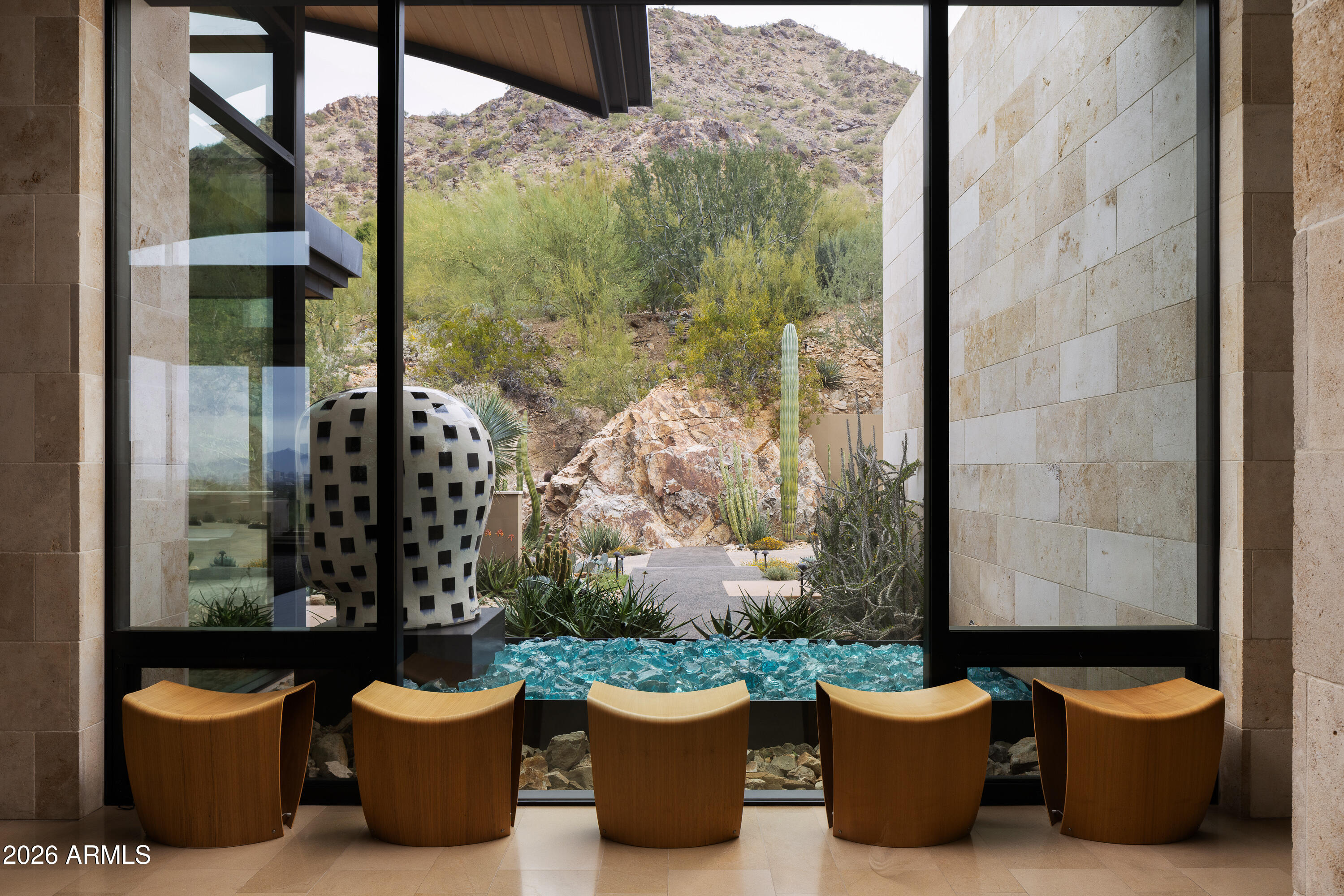 5248 East Arroyo Road Paradise Valley, AZ 85253 - Photo 25 of 31 a view of a balcony with chair and potted plants