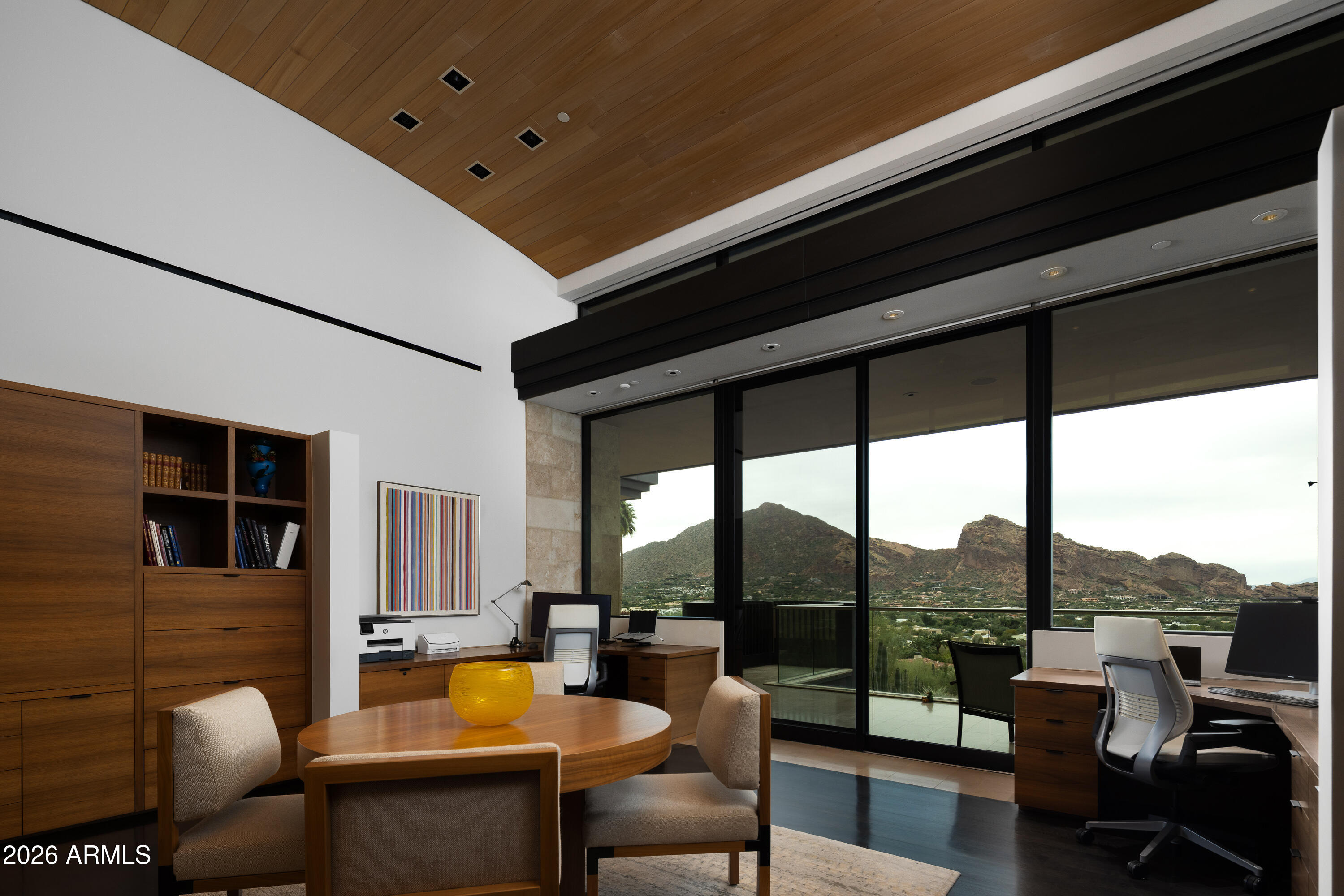 5248 East Arroyo Road Paradise Valley, AZ 85253 - Photo 26 of 31 a living room with fireplace furniture and a floor to ceiling window