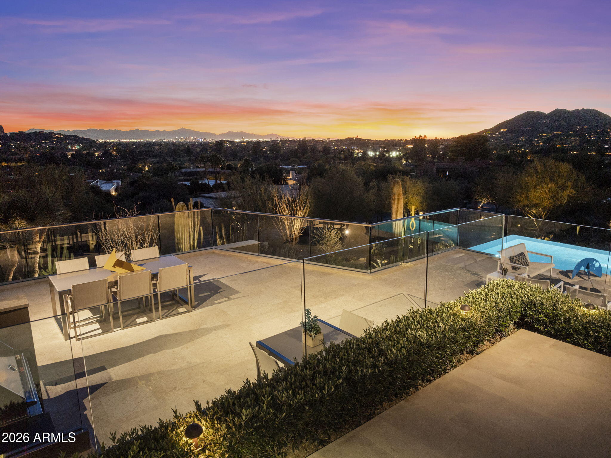 5248 East Arroyo Road Paradise Valley, AZ 85253 - Photo 3 of 31 a view of a terrace with furniture and a garden