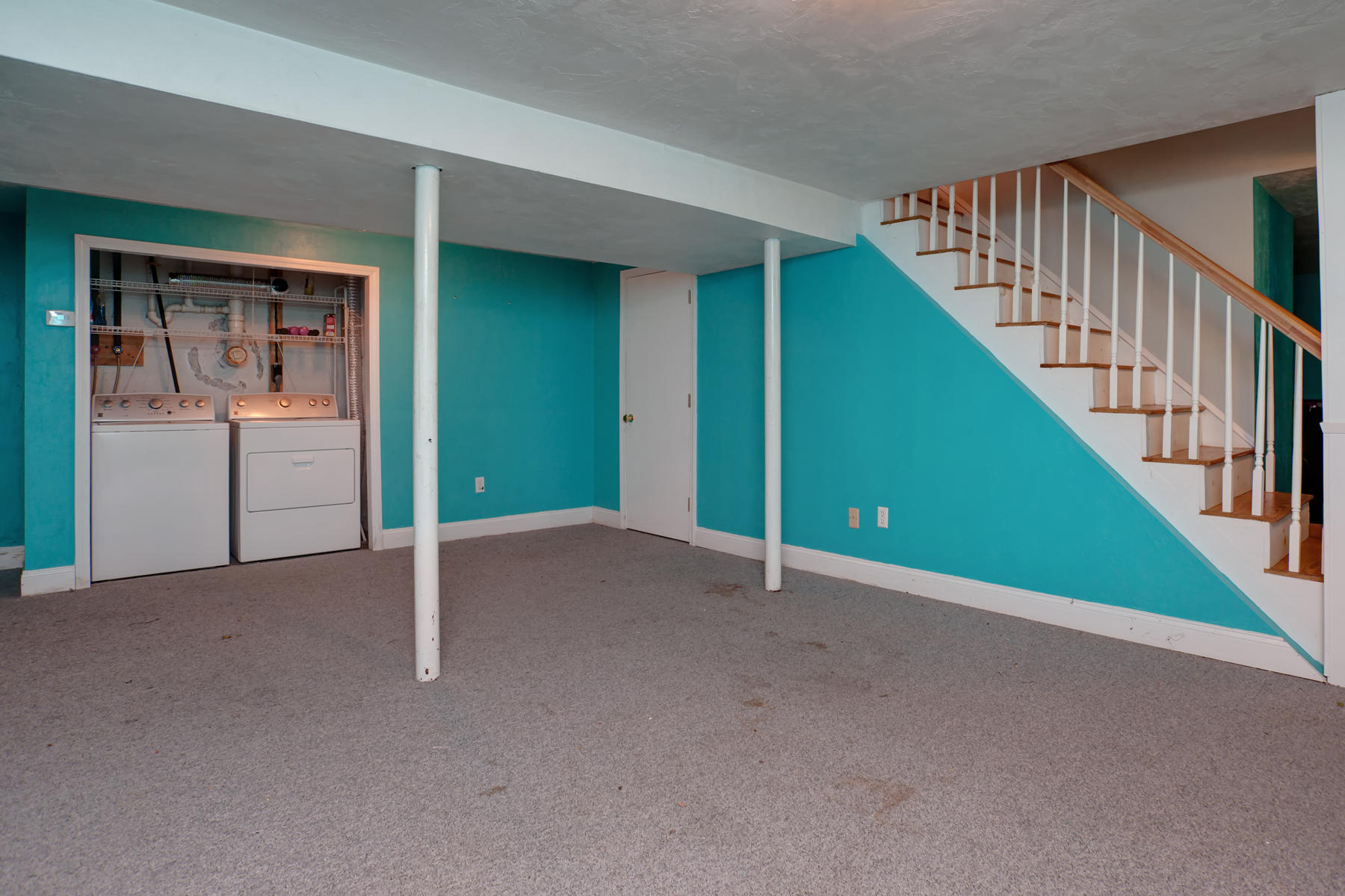 178 Farmersville Road Sandwich, MA 02563 - Photo 20 of 25 a view of an empty room with stairs and a window
