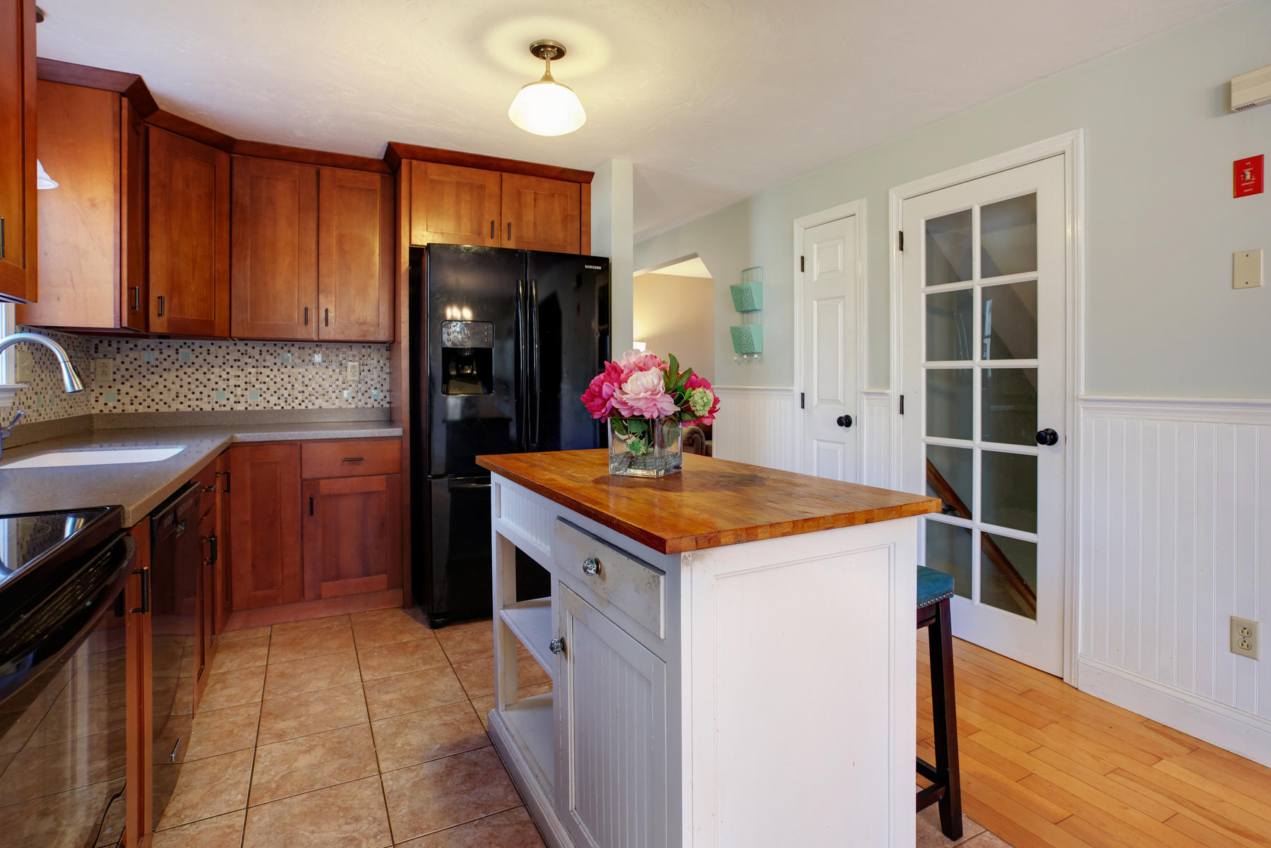 178 Farmersville Road Sandwich, MA 02563 - Photo 9 of 25 a kitchen with granite countertop a sink stove and cabinets