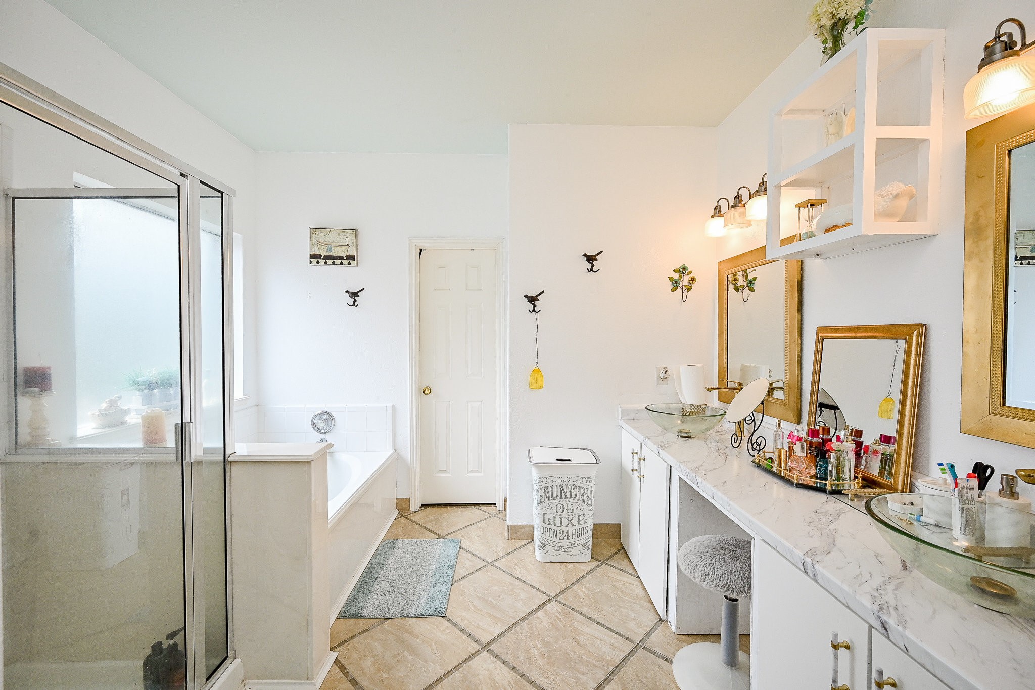 719 Winter Pines Court Spring, TX 77373 - Photo 13 of 20 a bathroom with a sink mirror and a shower