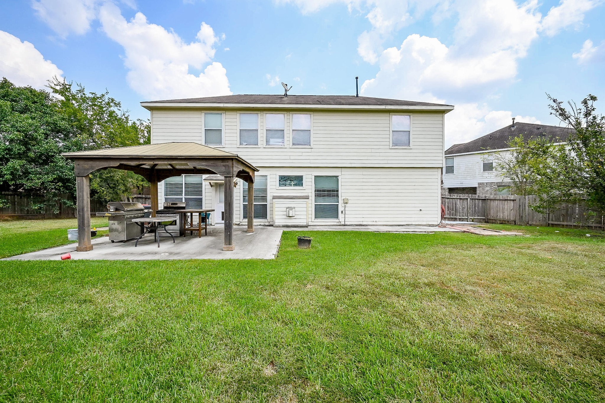 719 Winter Pines Court Spring, TX 77373 - Photo 20 of 20 a view of a house with backyard and sitting area