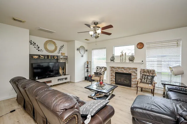 a living room with furniture and a fireplace
