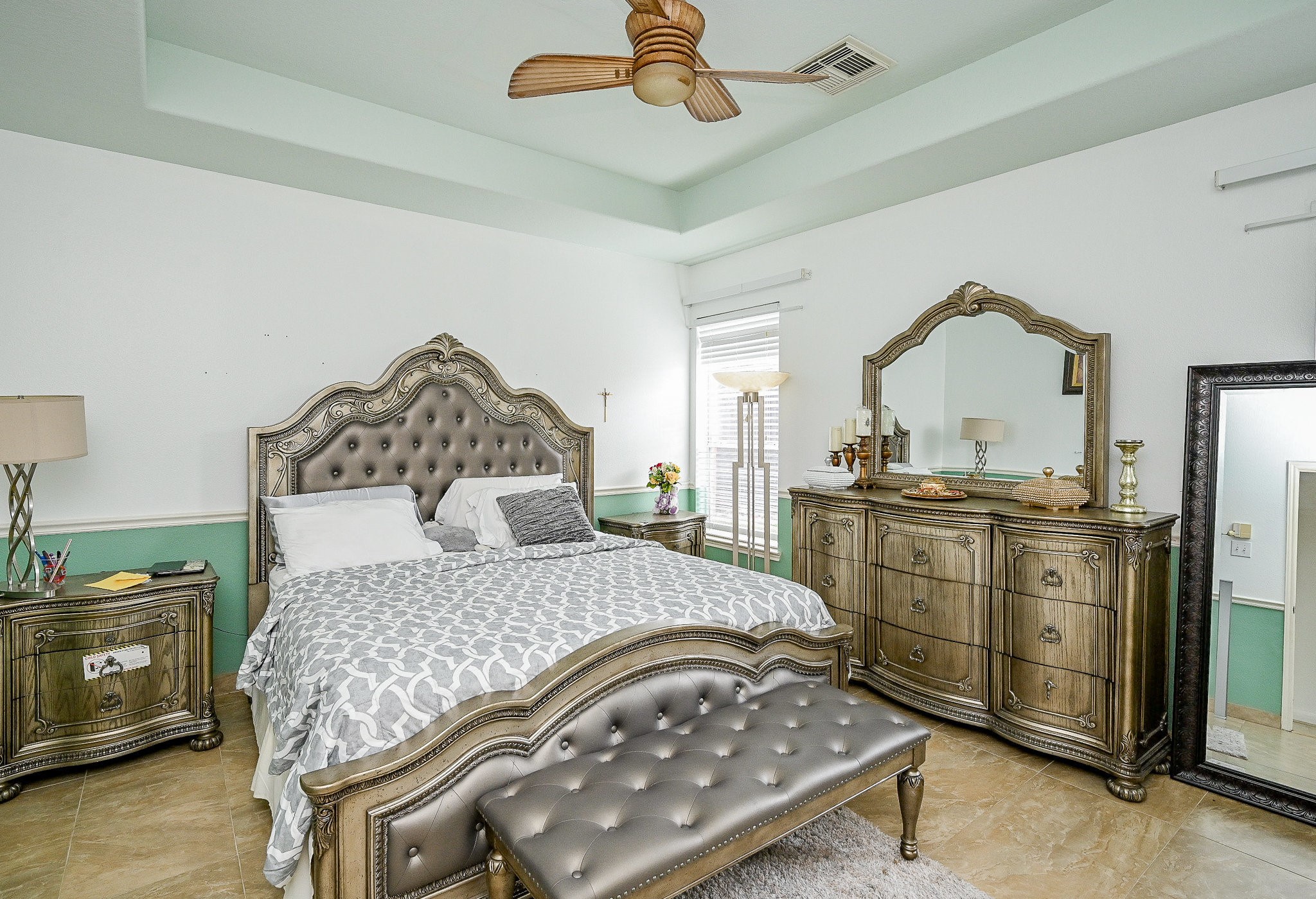 719 Winter Pines Court Spring, TX 77373 - Photo 10 of 20 a bedroom with a bed and a tv on the dresser