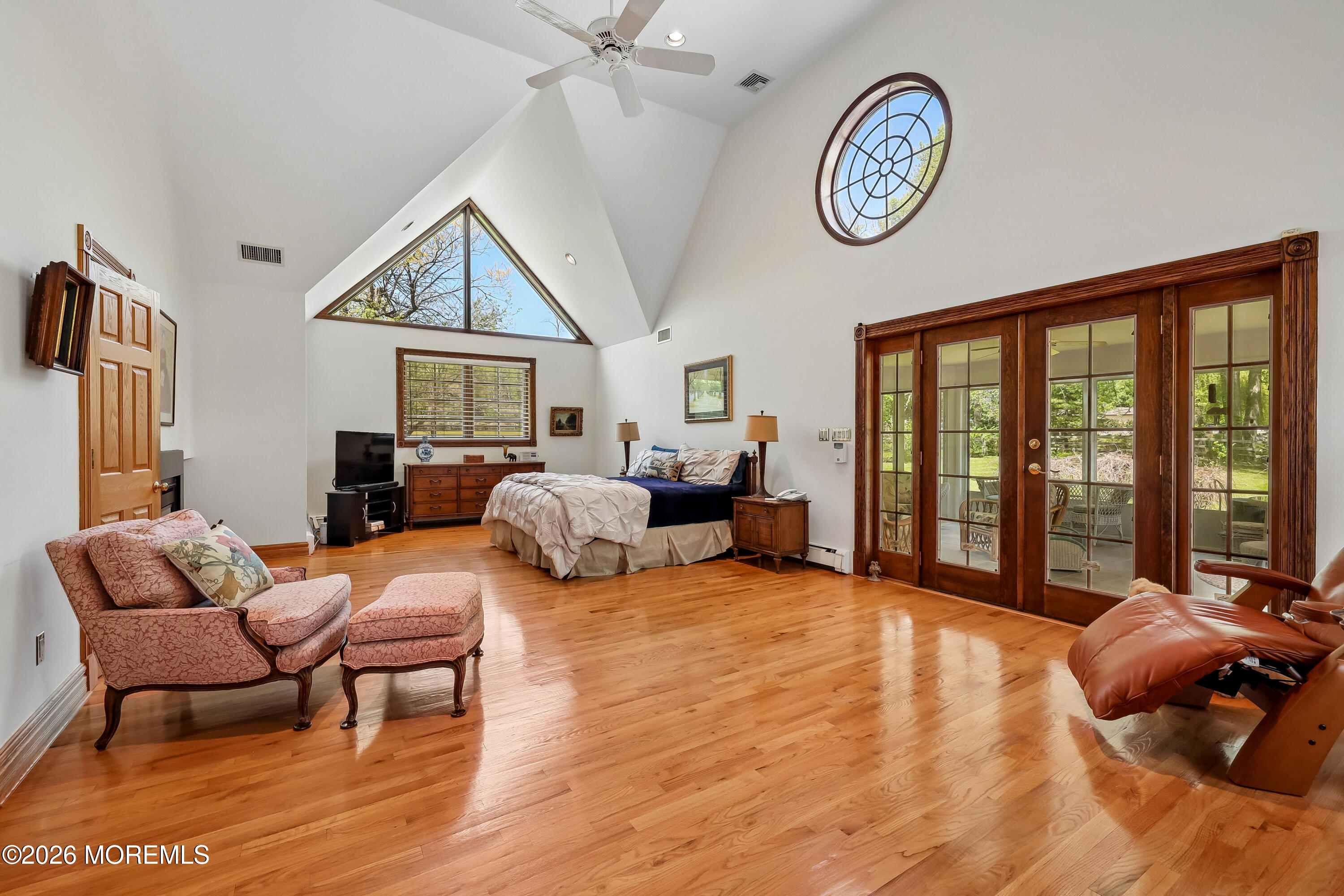 187 Hockhockson Road Colts Neck, NJ 07722 - Photo 28 of 55 a bedroom with furniture and a large window