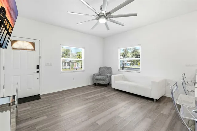 a living room with furniture and a window
