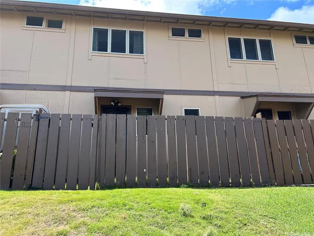 a view of a backyard of the house