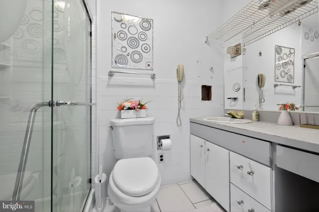 a spacious bathroom with a toilet sink and shower