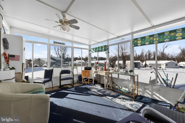 a view of a livingroom with furniture and a table