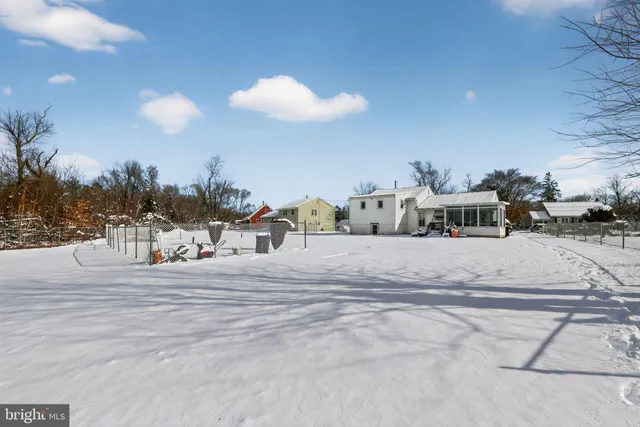 a view of a house with a yard and street view