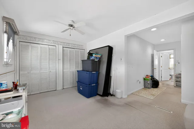 a view of a livingroom with furniture and a flat screen tv