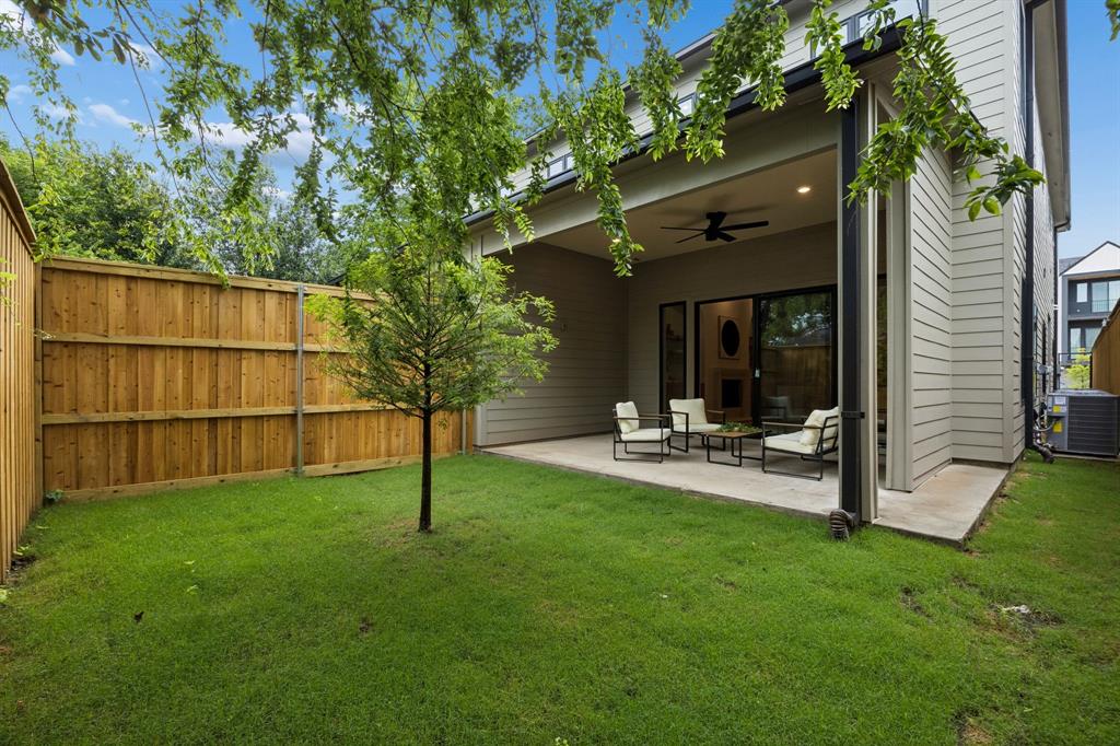4615 Rusk Avenue Dallas, TX 75204 - Photo 25 of 25 a view of a chair and table in backyard of the house